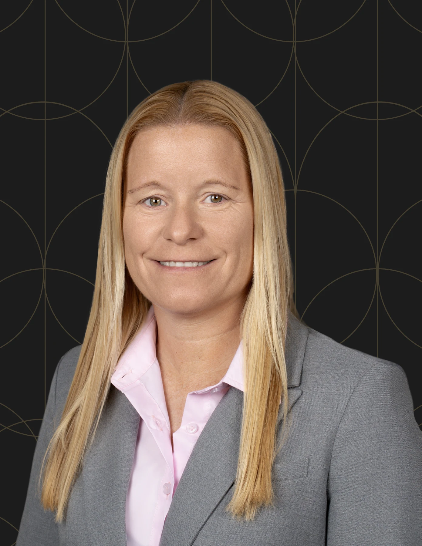 hmg-plus-team-member-headshot-blonde-gray-blazer-hmg-plus. Monique Van Deelen-Lewis, Director of Finance And Accounting
